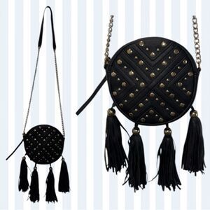 Kiss Me Couture woman’s round shoulder bag / purse with studs & tassels.